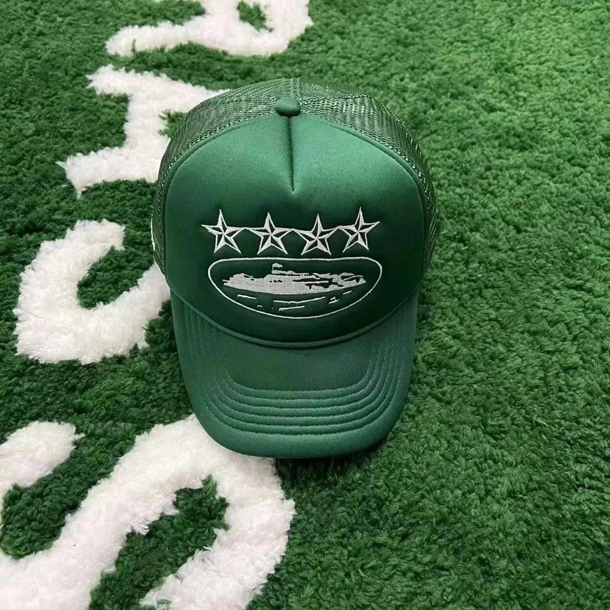 Green Trucker Hat with Embroidered Ship and Stars Design