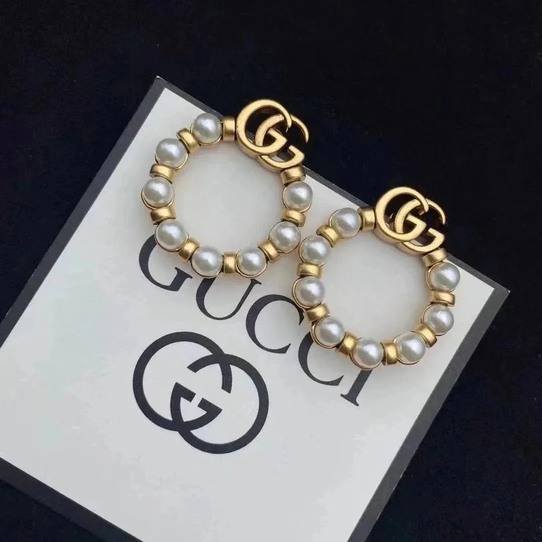 Gucci Pearl and Gold Interlocking G Bracelets