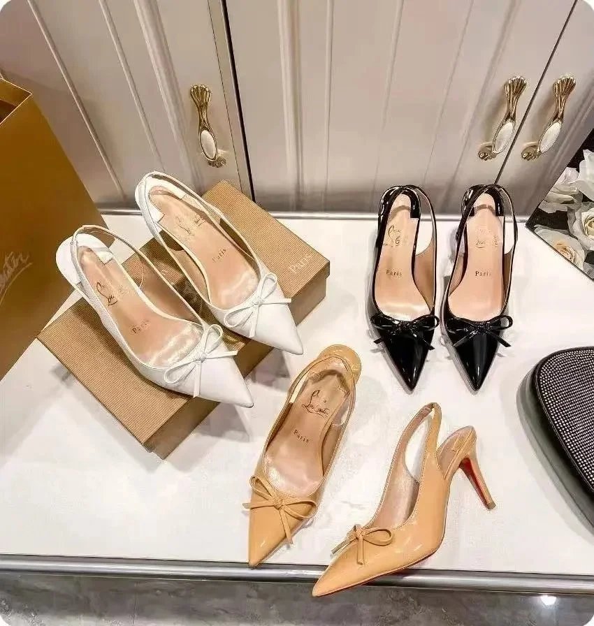 Christian Louboutin Women's Pointed Toe Pumps with Bow Detail